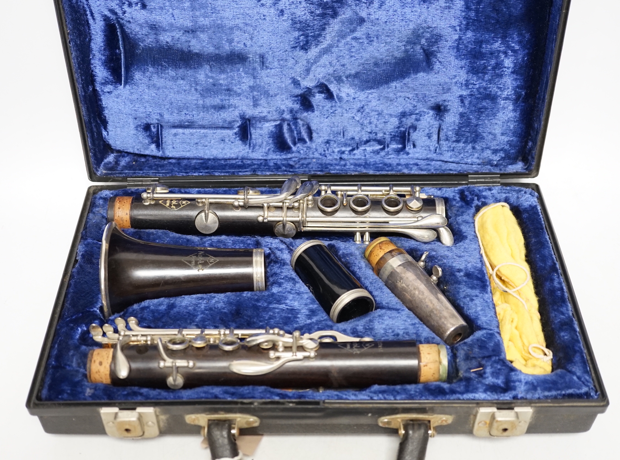 A cased French clarinet by Noblet, Paris